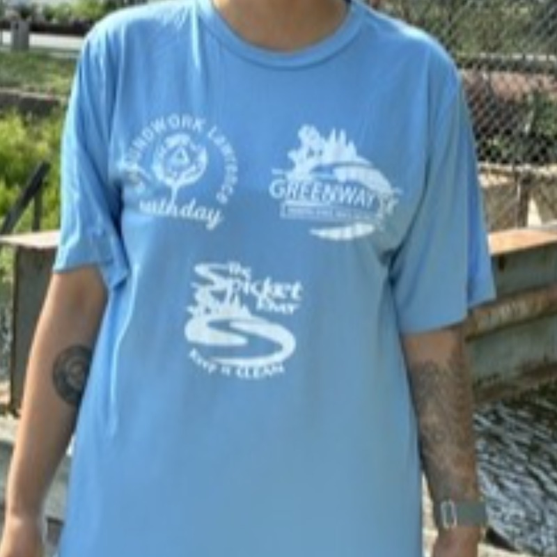 Light blue shirt with GWL major events logos on front