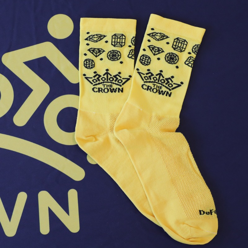 Yellow DeFeet socks with fun CROWN gems and logo.